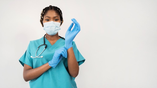 Medium shot woman wearing gloves