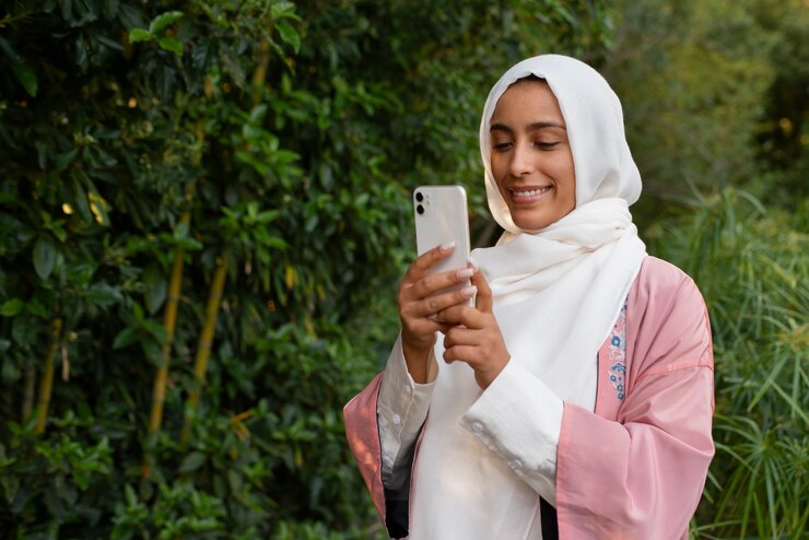 Free Photo medium shot woman wearing halal outdoors