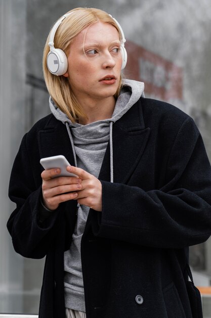 Medium shot woman  wearing headphones