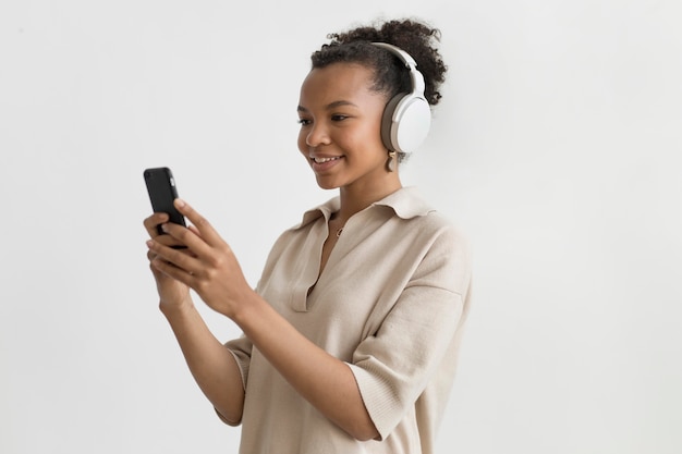 Medium shot woman wearing headphones