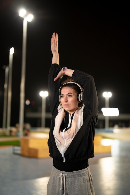 Free photo medium shot woman wearing headphones