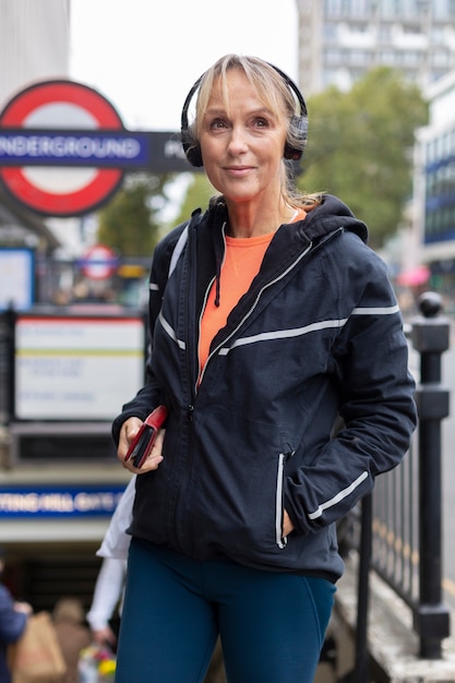 Free photo medium shot woman wearing headphones