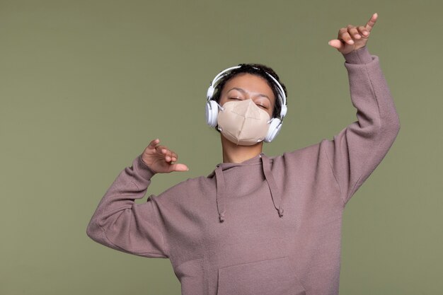 Medium shot woman wearing headphones