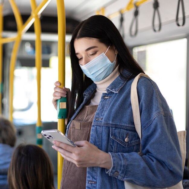 Medium shot woman wearing mask