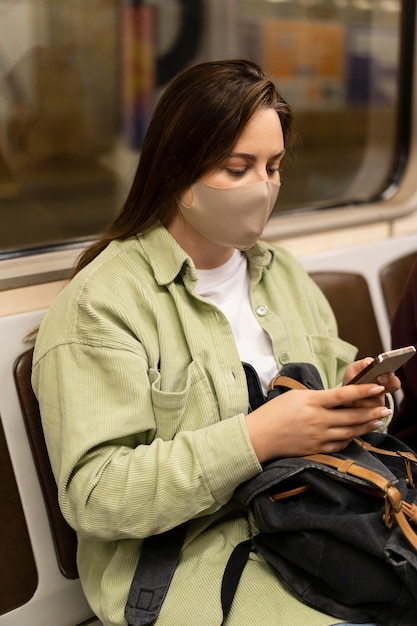 Medium shot woman wearing mask