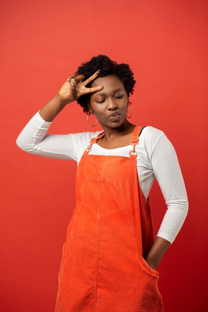 Medium shot woman wearing red rompers