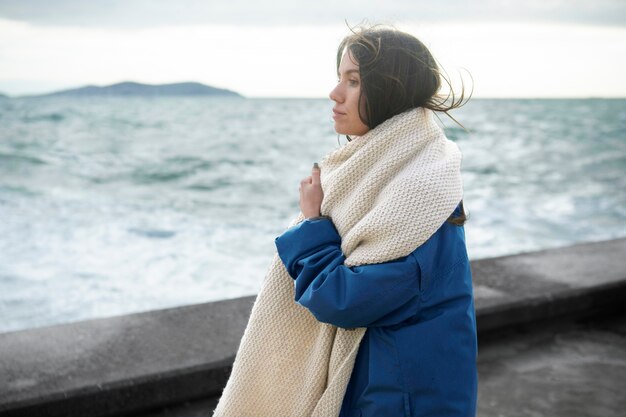 Medium shot woman wearing scarf