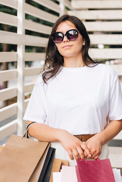 Medium shot woman wearing sunglasses