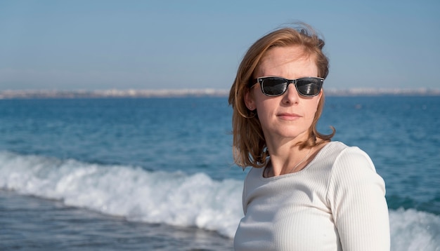 Medium shot woman wearing sunglasses