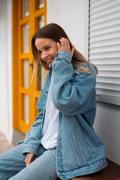 Medium shot woman wearing total denim outfit