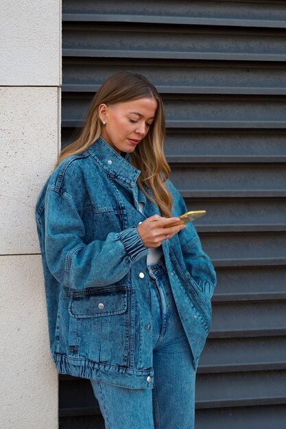 Medium shot woman wearing total denim outfit