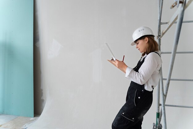 Medium shot woman wearing white helmet