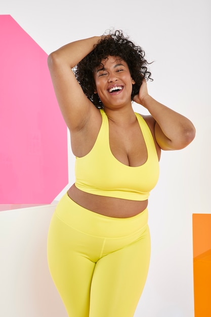 Medium shot woman wearing yellow sporty outfit