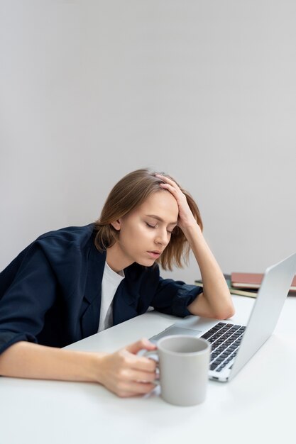 Medium shot woman with adhd at work