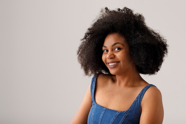 Medium shot woman with afro hairstyle