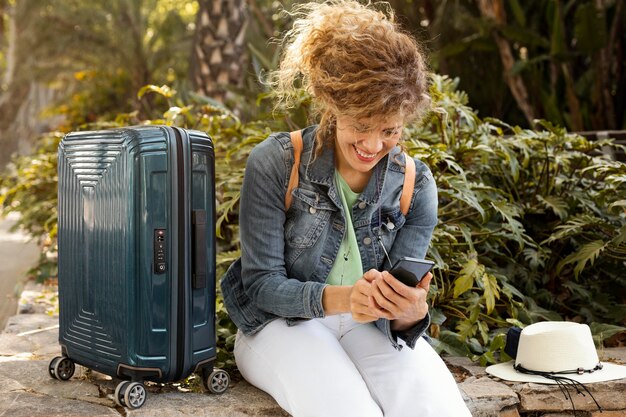 Medium shot woman with baggage