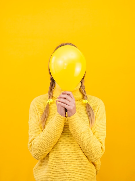 Medium shot woman with balloon