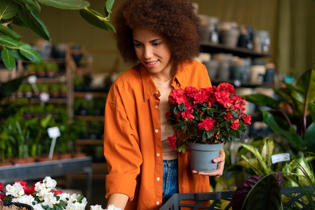 Medium shot woman with beautiful sunflowers