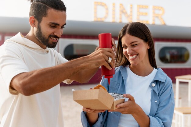 Medium shot woman with burger