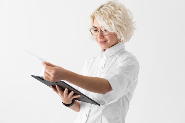 medium shot woman with clipboard