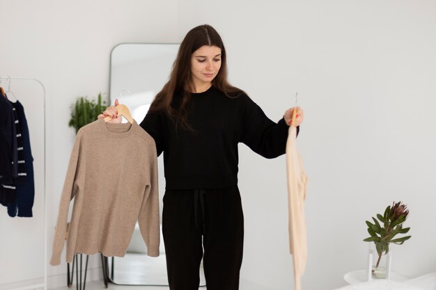 medium shot woman with clothes