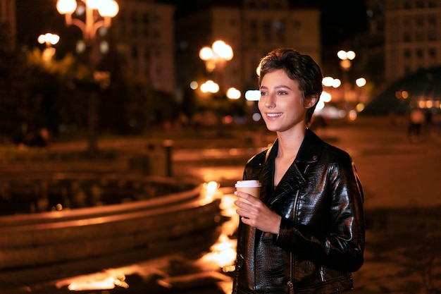 Medium shot woman with coffee cup