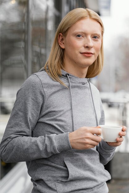 Medium shot woman with cup