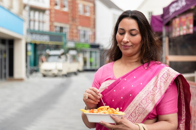 Medium shot woman with delicious food