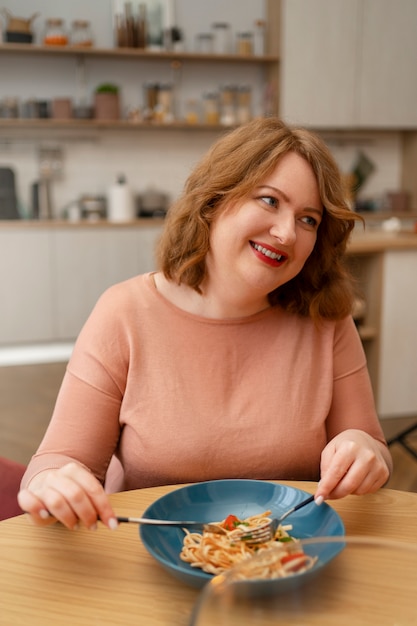 Medium shot woman with delicious food