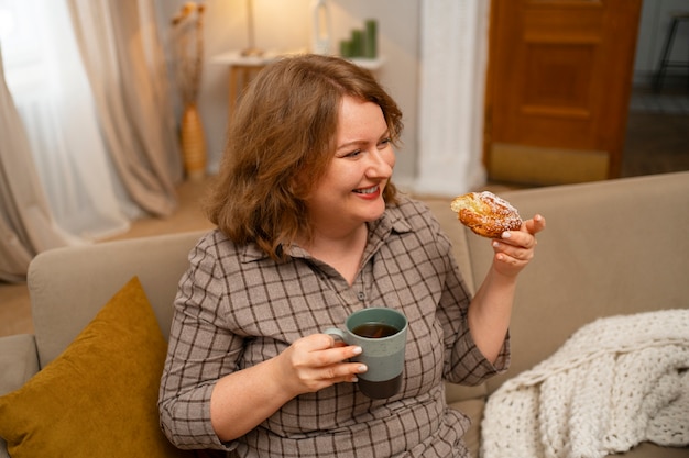 Medium shot woman with delicious food