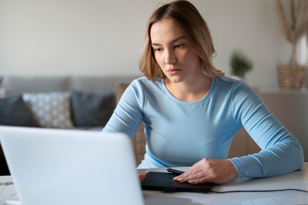 Medium shot woman with device