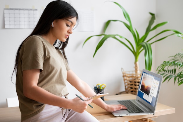 Medium shot woman with device