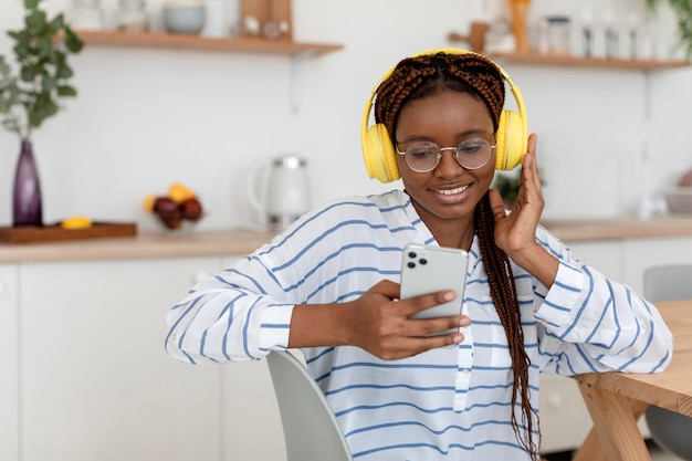 Medium shot woman with devices