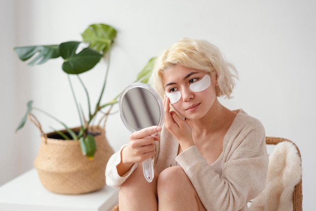 Medium shot woman with eye patches