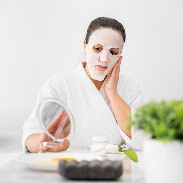 Medium shot woman with face mask