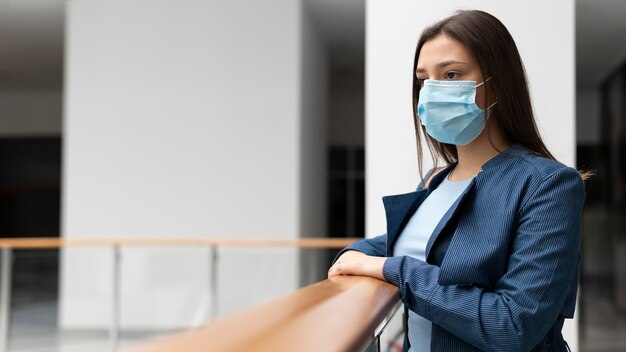 Medium shot woman with face mask