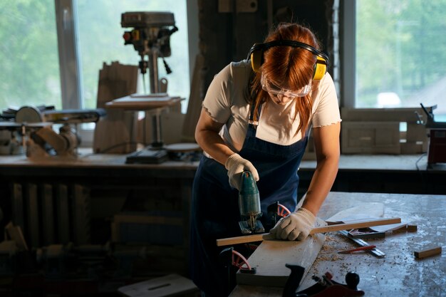 Medium shot woman with headphones and goggles