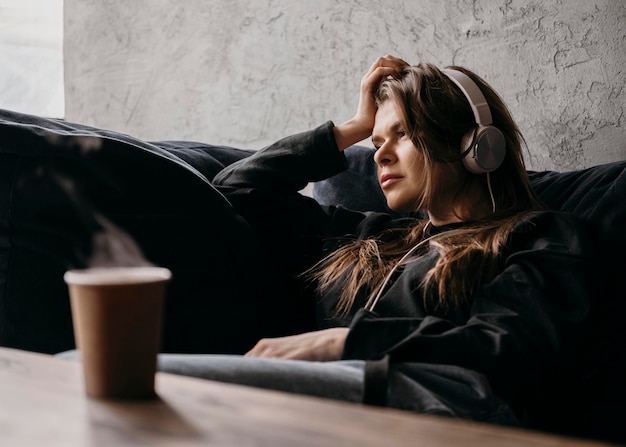 Free photo medium shot woman with headphones