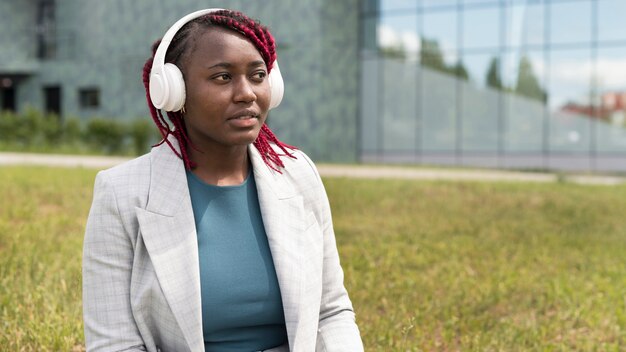 Medium shot woman with headphones