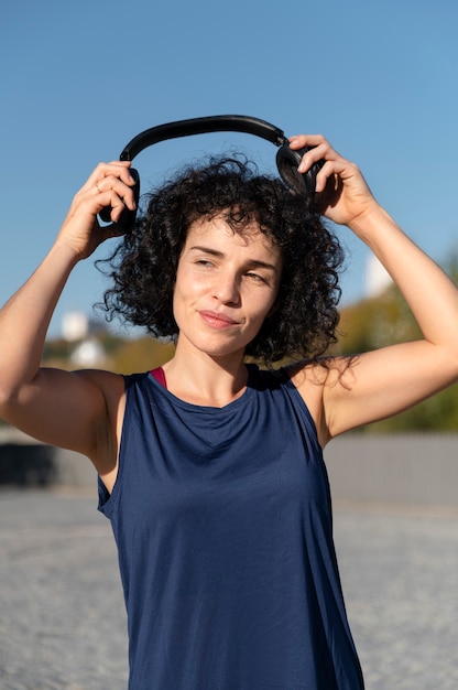 Medium shot woman with headphones