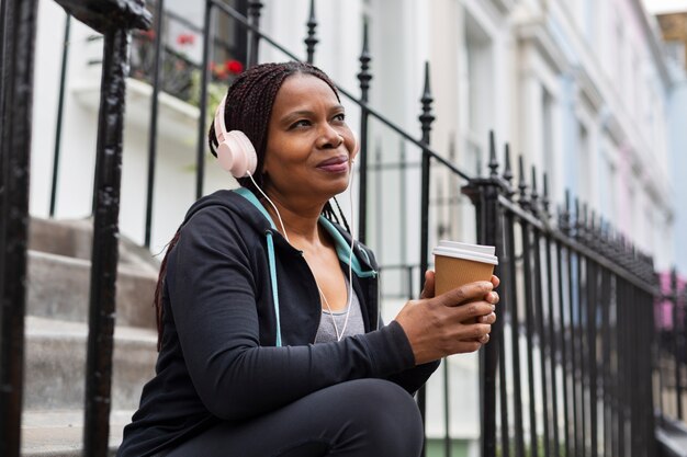 Medium shot woman with headphones