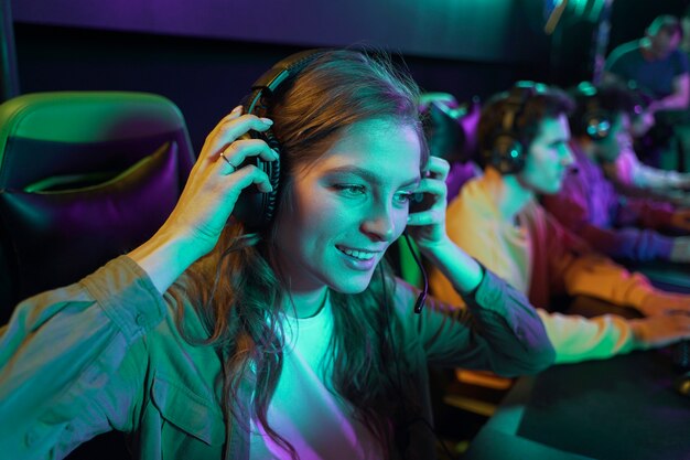 Medium shot woman with headphones