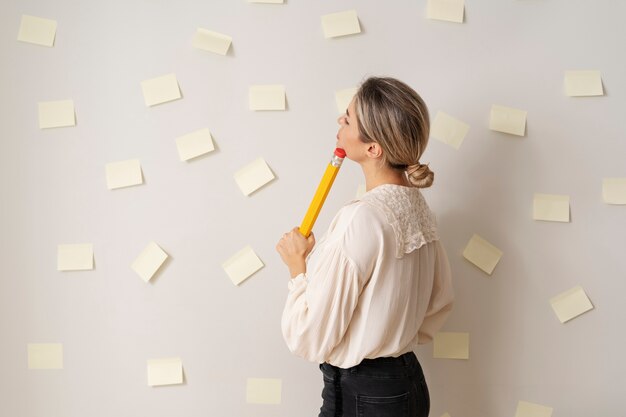 Free Photo medium shot woman with huge pencil