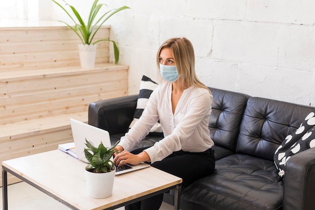 Medium shot woman with medical mask