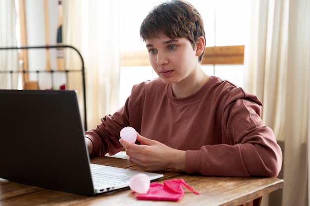 Medium shot woman with menstrual product