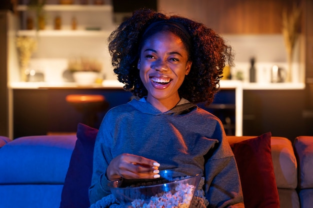 Medium shot woman with popcorn