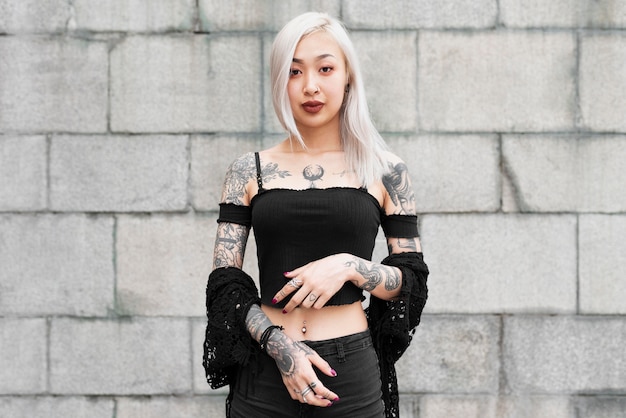 Medium shot woman with tattoos