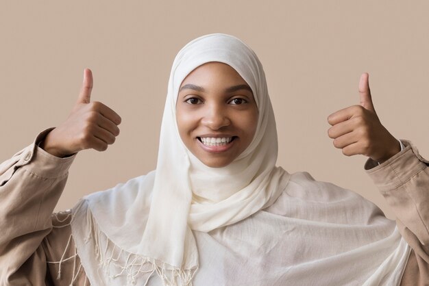 Medium shot woman with thumbs up