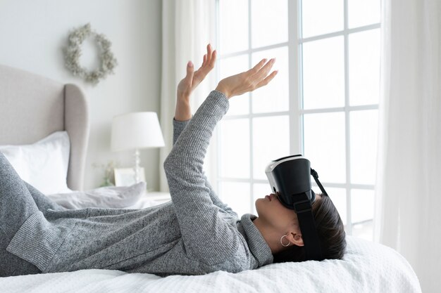 Medium shot woman with vr glasses