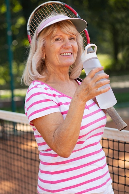 Medium shot woman with water bottle